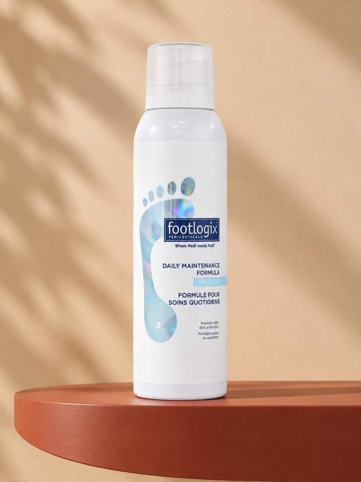 Footlogix Daily Maintenance Formula mousse on a terracotta pedestal