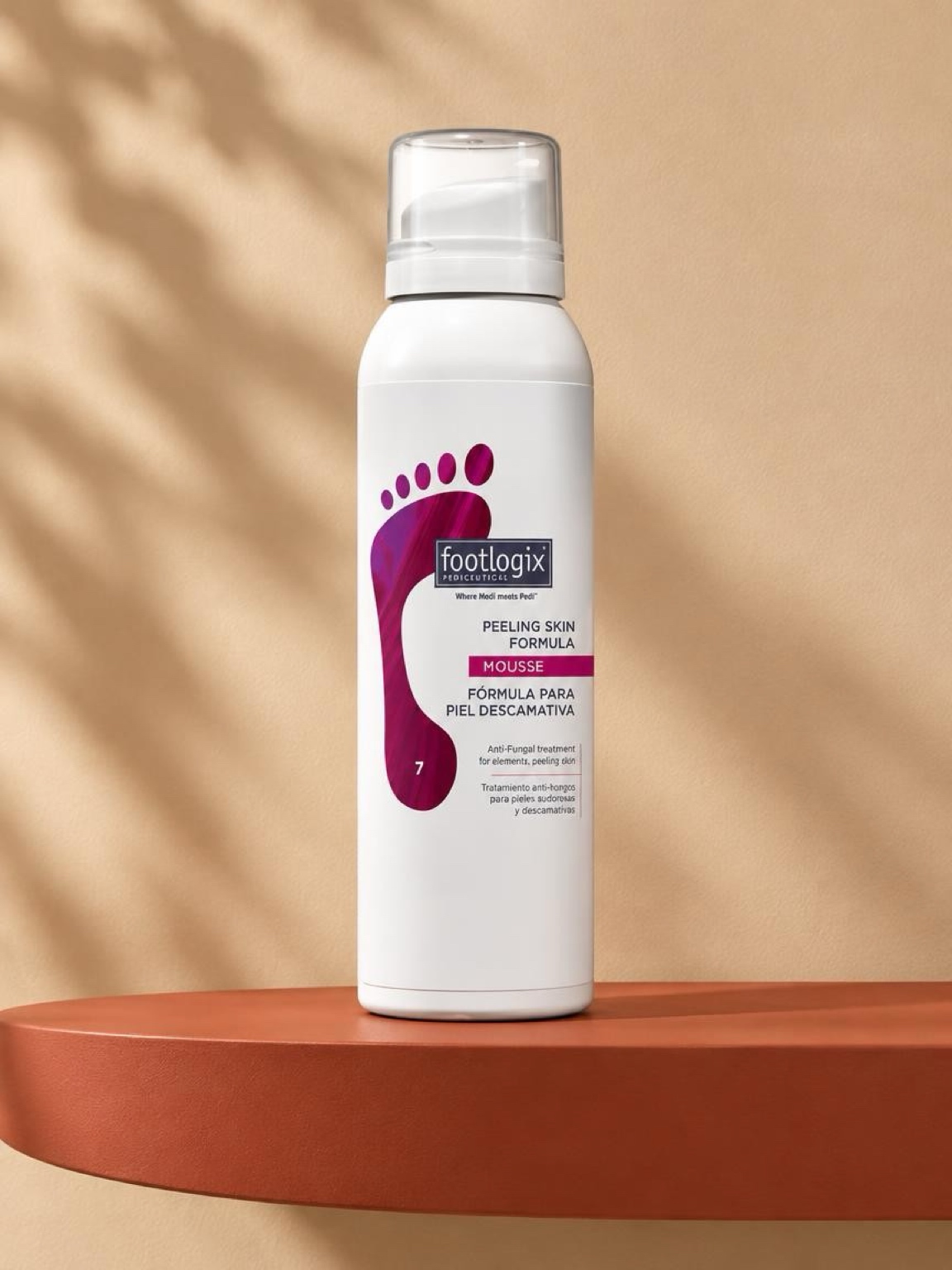 Footlogix Peeling Skin Formula mousse on a terracotta shelf