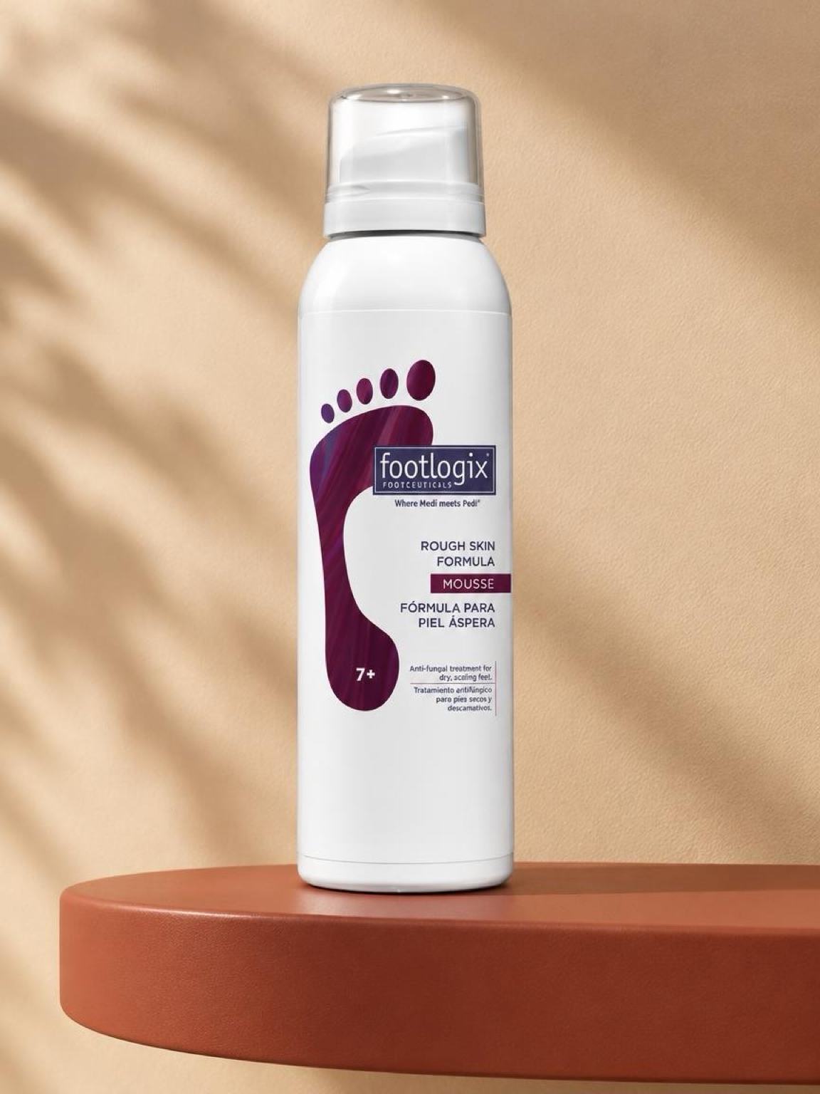 Footlogix Rough Skin Formula mousse on a terracotta pedestal