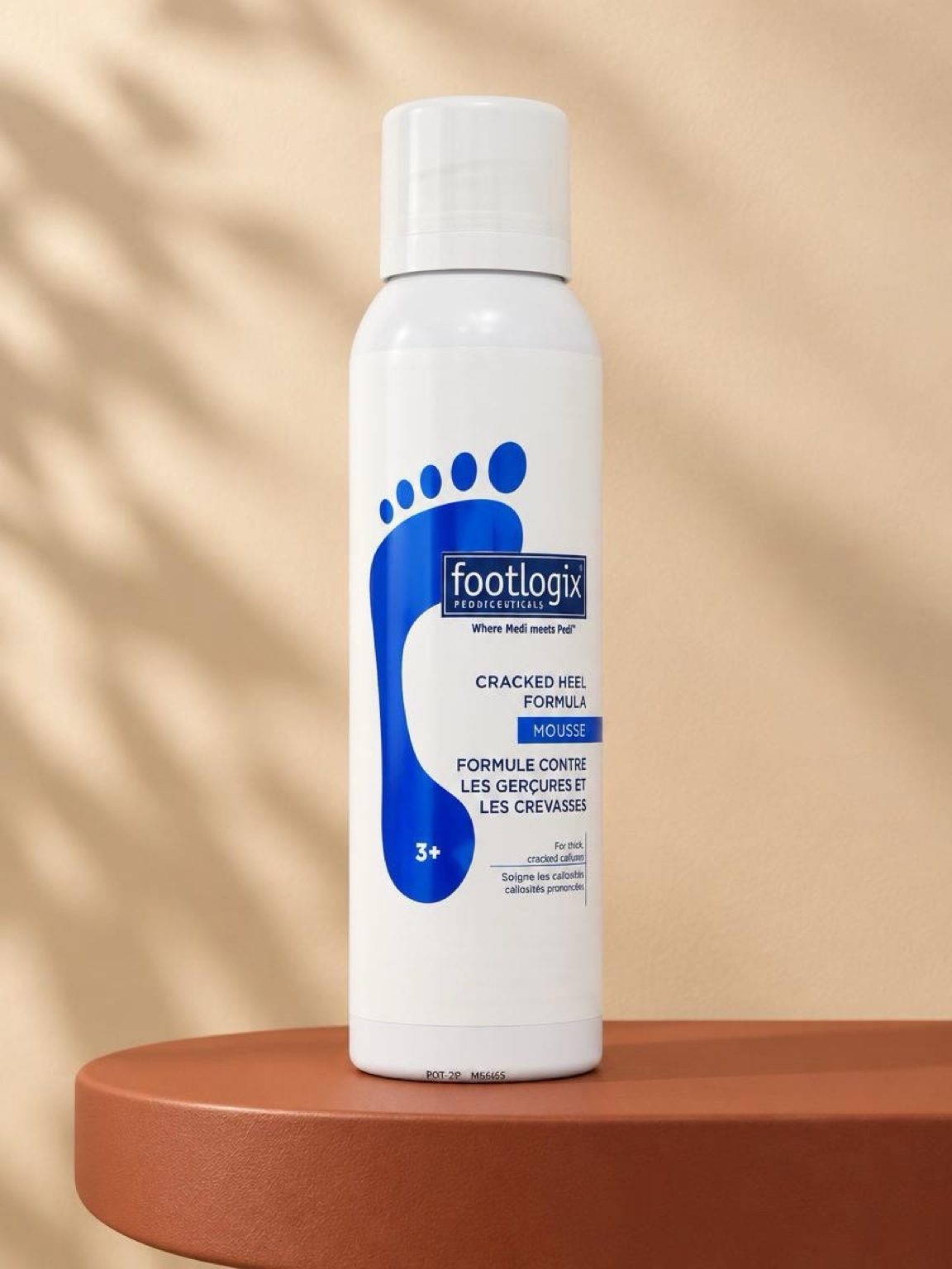 Footlogix Cracked Heel Formula mousse on a terracotta pedestal